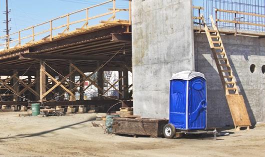 a number of portable outdoor potties meant for workers' usage